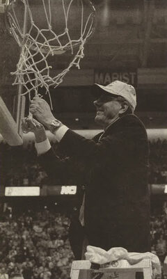 Jim Boeheim cuts down the net in Albany at the end of the East Region championship. Hakim Warrick cut down the other net on the court. 