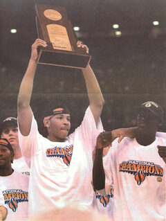 Carmelo Anthony and other Orangemen hold up the championship trophy, the first one for head coach Jim Boeheim.