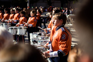 The Syracuse University drumline opens the quad show with introductions and a performance of cadences. Tenor drum player Anthony Riello focused on the crowd as he played through the group’s set. 