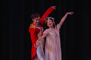 Clara dances with her nutcracker after he has been transformed back into a prince. The two danced a duet toward the end of Act I right before Clara entered the Land of Sweets. 