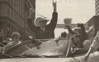 Coach Jim Boeheim, wearing his giant orange cowboy hat, rides in the parade held Saturday, April 12, 2003 honoring the 2003 NCAA national champions.