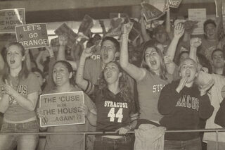 Fans cheer at the Carrier Dome for the Syracuse University Orangemen as they take on the Kansas Jayhawks on Monday, April 7, 2003. About 11,000 people watched the game at the Dome.