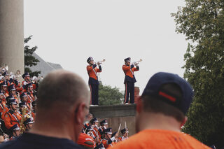 Families enjoy the Syracuse University marching band’s pregame performance on the steps of Hendricks Chapel before the football game on Saturday, Sept. 9. SU won against Western Michigan, strengthening the crowd’s high spirits.